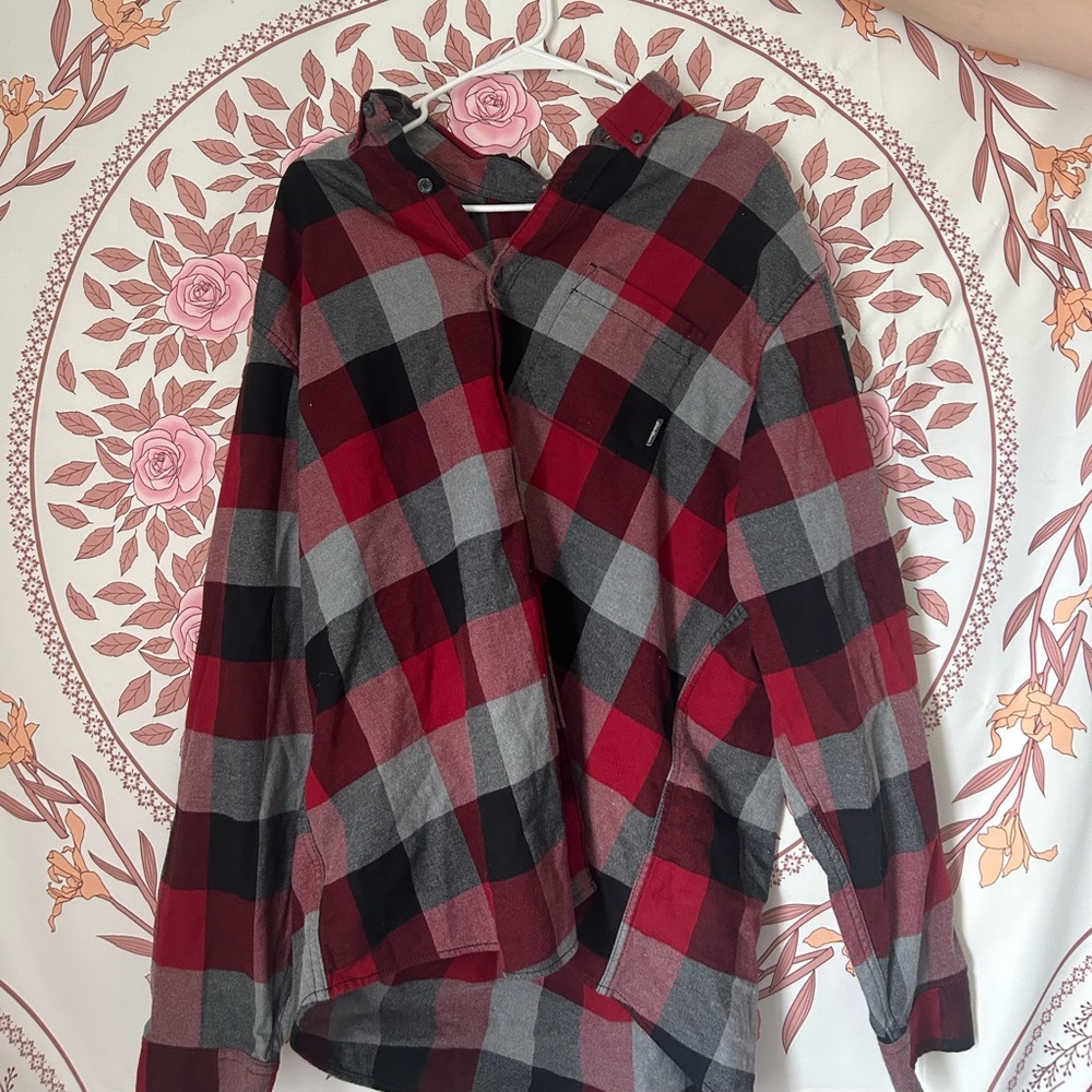 A men’s 2xl sized flannel. Long sleeved, and red, black, and gray colored.